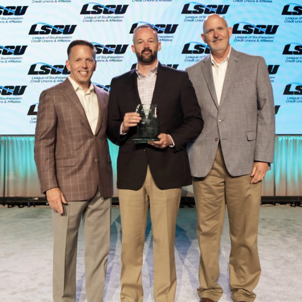 Champions First Credit Union President/CEO Chuck Adcock receiving credit union of the year award